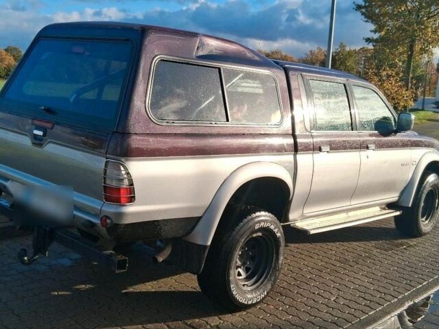 Серый Мицубиси Л 200, объемом двигателя 2.5 л и пробегом 183 тыс. км за 2500 $, фото 2 на Automoto.ua