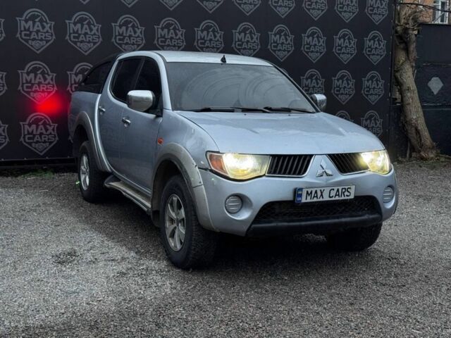 Серый Мицубиси Л 200, объемом двигателя 2.5 л и пробегом 260 тыс. км за 9900 $, фото 1 на Automoto.ua