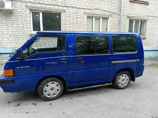 Синій Міцубісі Л 200, об'ємом двигуна 2 л та пробігом 400 тис. км за 3100 $, фото 1 на Automoto.ua