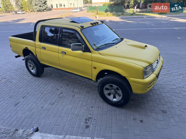Синій Міцубісі Л 200, об'ємом двигуна 0 л та пробігом 300 тис. км за 6296 $, фото 1 на Automoto.ua