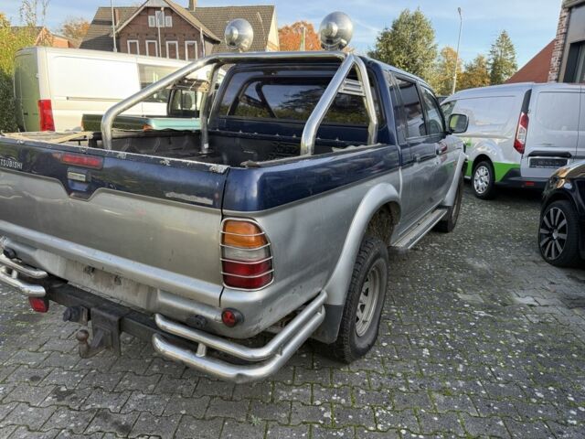 Синий Мицубиси Л 200, объемом двигателя 2.5 л и пробегом 270 тыс. км за 3583 $, фото 7 на Automoto.ua