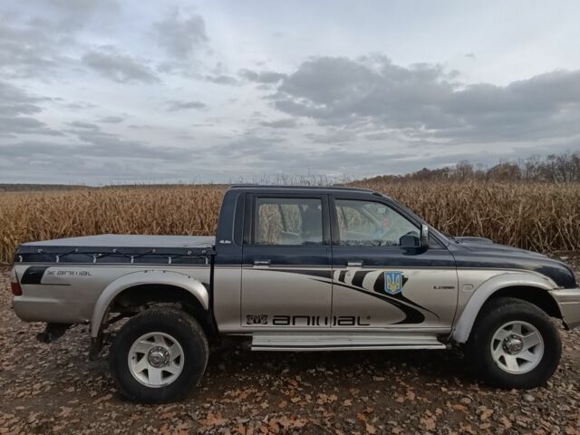 Синій Міцубісі Л 200, об'ємом двигуна 2.5 л та пробігом 276 тис. км за 5300 $, фото 2 на Automoto.ua