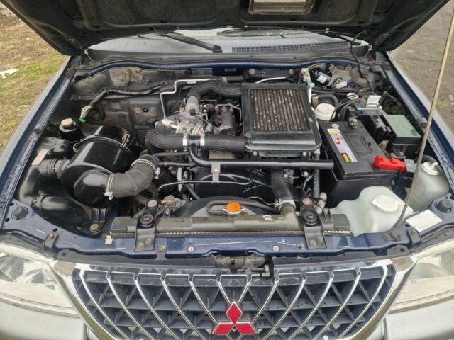 Синій Міцубісі Л 200, об'ємом двигуна 2.5 л та пробігом 250 тис. км за 6528 $, фото 14 на Automoto.ua