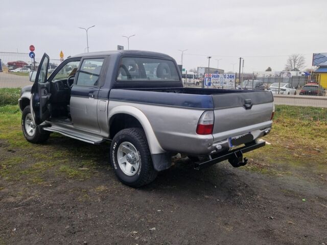 Синій Міцубісі Л 200, об'ємом двигуна 2.5 л та пробігом 250 тис. км за 6528 $, фото 11 на Automoto.ua