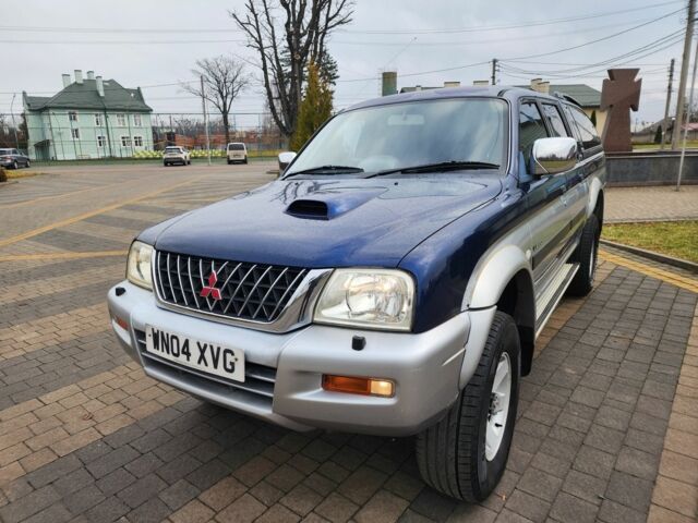 Синій Міцубісі Л 200, об'ємом двигуна 2.5 л та пробігом 105 тис. км за 7574 $, фото 6 на Automoto.ua