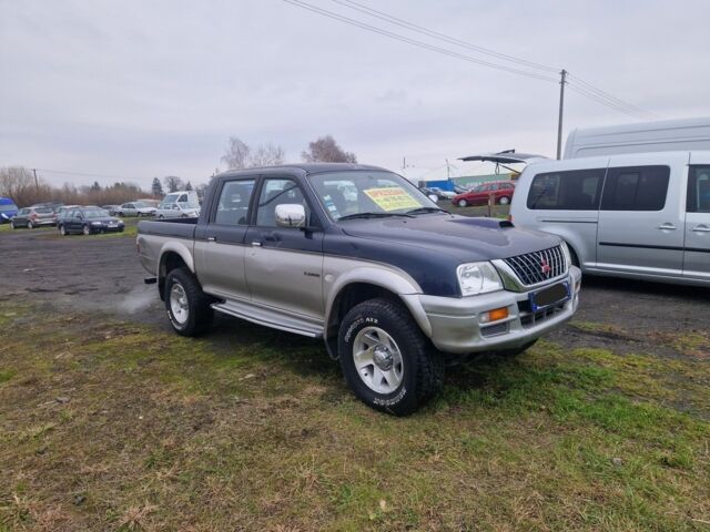 Синій Міцубісі Л 200, об'ємом двигуна 2.5 л та пробігом 250 тис. км за 6528 $, фото 7 на Automoto.ua