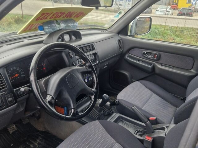 Синій Міцубісі Л 200, об'ємом двигуна 2.5 л та пробігом 250 тис. км за 6528 $, фото 10 на Automoto.ua