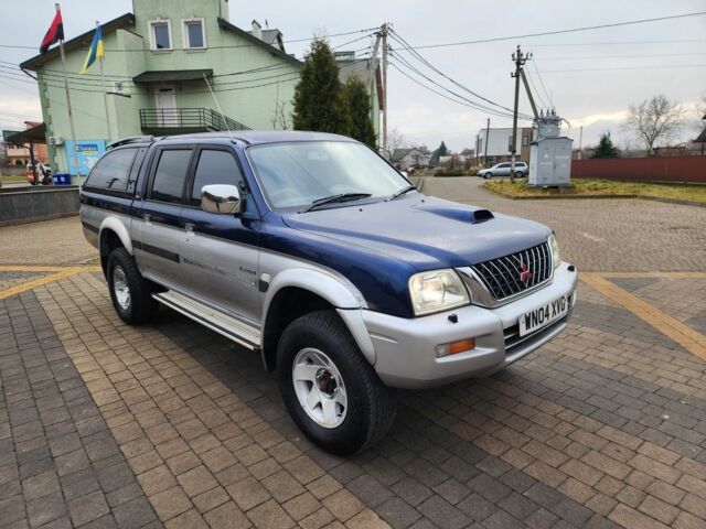 Синій Міцубісі Л 200, об'ємом двигуна 2.5 л та пробігом 105 тис. км за 7574 $, фото 2 на Automoto.ua