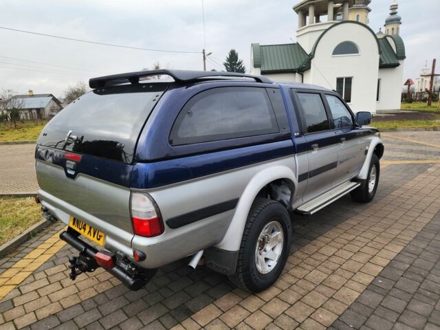 Синій Міцубісі Л 200, об'ємом двигуна 2.5 л та пробігом 105 тис. км за 7574 $, фото 12 на Automoto.ua