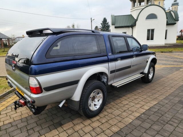 Синій Міцубісі Л 200, об'ємом двигуна 2.5 л та пробігом 105 тис. км за 7574 $, фото 13 на Automoto.ua