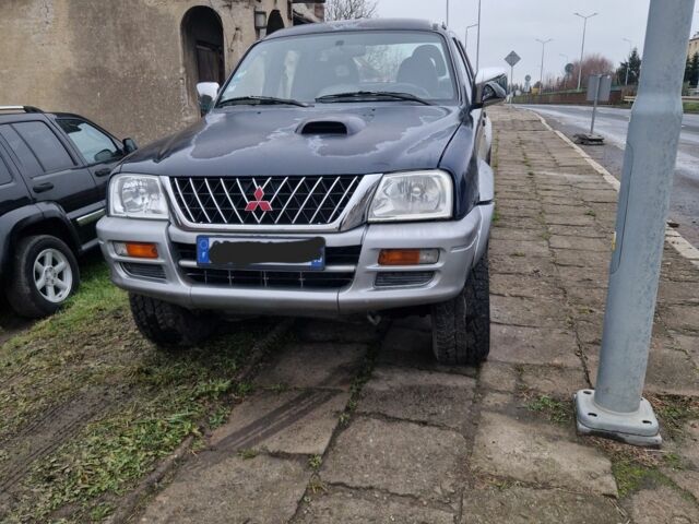 Синій Міцубісі Л 200, об'ємом двигуна 2.5 л та пробігом 250 тис. км за 6528 $, фото 2 на Automoto.ua