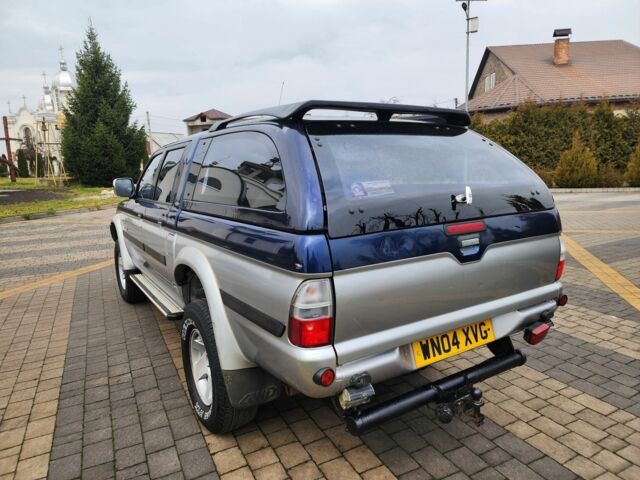 Синій Міцубісі Л 200, об'ємом двигуна 2.5 л та пробігом 105 тис. км за 7574 $, фото 9 на Automoto.ua