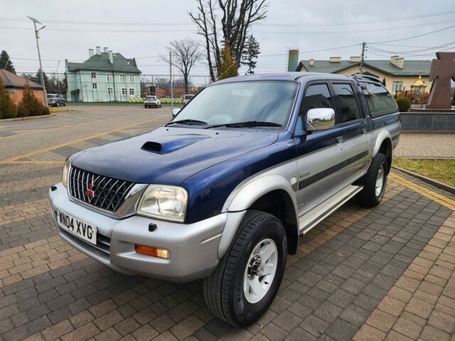 Синій Міцубісі Л 200, об'ємом двигуна 2.5 л та пробігом 105 тис. км за 7574 $, фото 7 на Automoto.ua