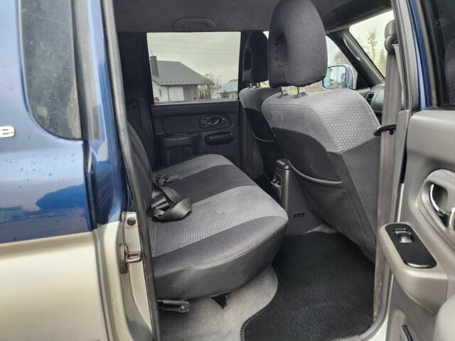 Синій Міцубісі Л 200, об'ємом двигуна 2.5 л та пробігом 105 тис. км за 7574 $, фото 21 на Automoto.ua