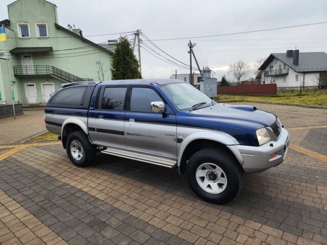 Синій Міцубісі Л 200, об'ємом двигуна 2.5 л та пробігом 105 тис. км за 7574 $, фото 3 на Automoto.ua