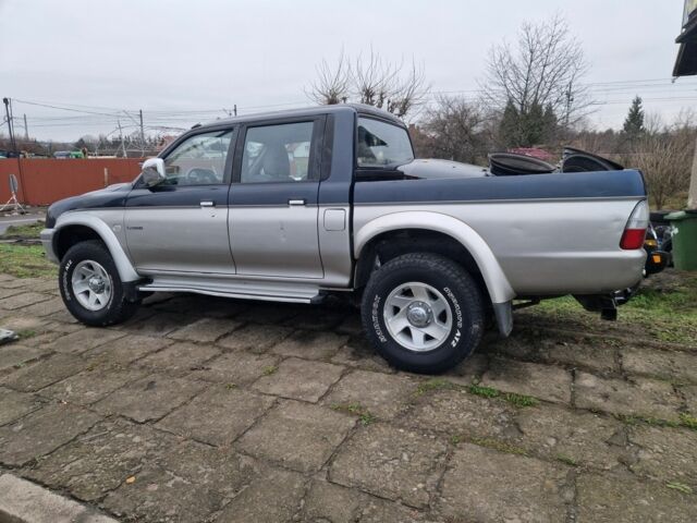 Синій Міцубісі Л 200, об'ємом двигуна 2.5 л та пробігом 250 тис. км за 6528 $, фото 3 на Automoto.ua