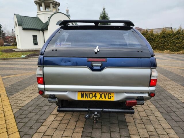 Синій Міцубісі Л 200, об'ємом двигуна 2.5 л та пробігом 105 тис. км за 7574 $, фото 10 на Automoto.ua