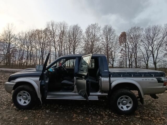 Синій Міцубісі Л 200, об'ємом двигуна 2.5 л та пробігом 276 тис. км за 5300 $, фото 1 на Automoto.ua