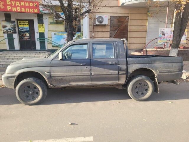 Синий Мицубиси Л 200, объемом двигателя 0 л и пробегом 324 тыс. км за 4700 $, фото 1 на Automoto.ua