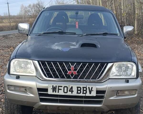 Синій Міцубісі Л 200, об'ємом двигуна 0 л та пробігом 276 тис. км за 5300 $, фото 12 на Automoto.ua