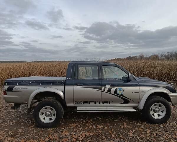 Синій Міцубісі Л 200, об'ємом двигуна 0 л та пробігом 276 тис. км за 5300 $, фото 8 на Automoto.ua