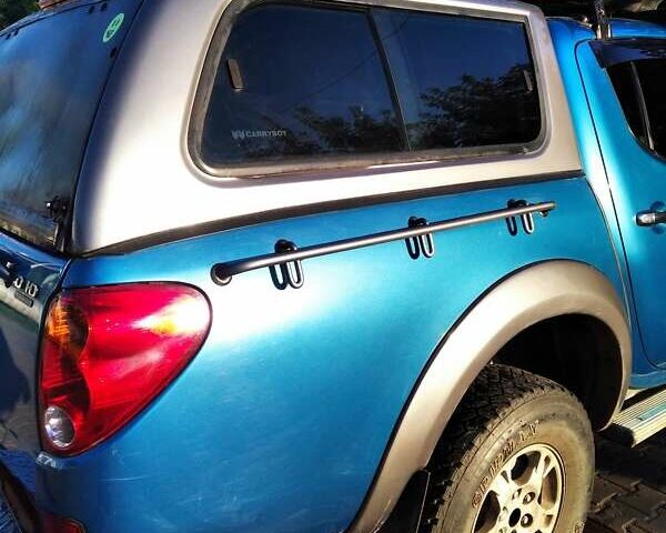 Синій Міцубісі Л 200, об'ємом двигуна 2.48 л та пробігом 224 тис. км за 12350 $, фото 1 на Automoto.ua