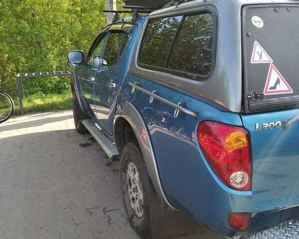 Синій Міцубісі Л 200, об'ємом двигуна 2.48 л та пробігом 224 тис. км за 12350 $, фото 5 на Automoto.ua