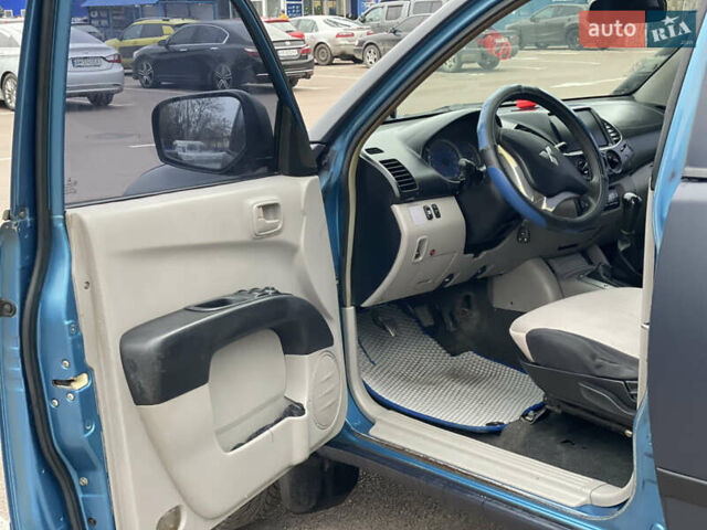 Синій Міцубісі Л 200, об'ємом двигуна 2.48 л та пробігом 469 тис. км за 10300 $, фото 6 на Automoto.ua