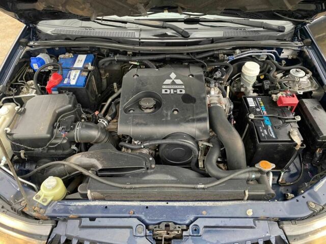 Синий Мицубиси Л 200, объемом двигателя 2.5 л и пробегом 291 тыс. км за 8200 $, фото 17 на Automoto.ua