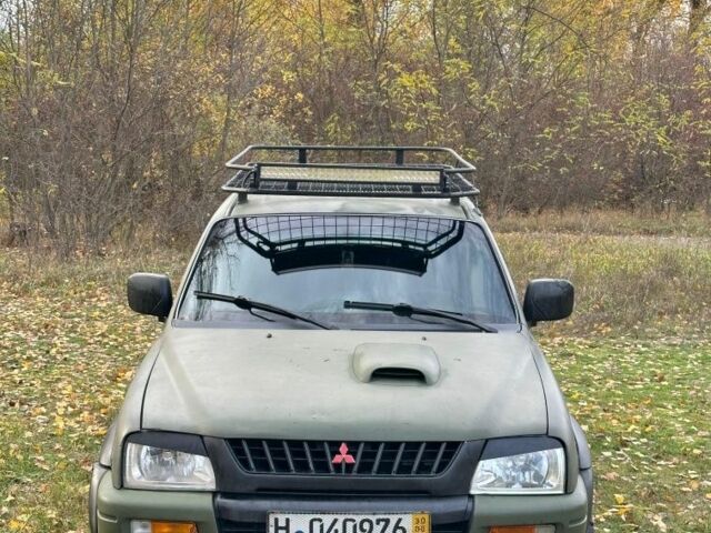 Зеленый Мицубиси Л 200, объемом двигателя 2.5 л и пробегом 280 тыс. км за 5700 $, фото 2 на Automoto.ua