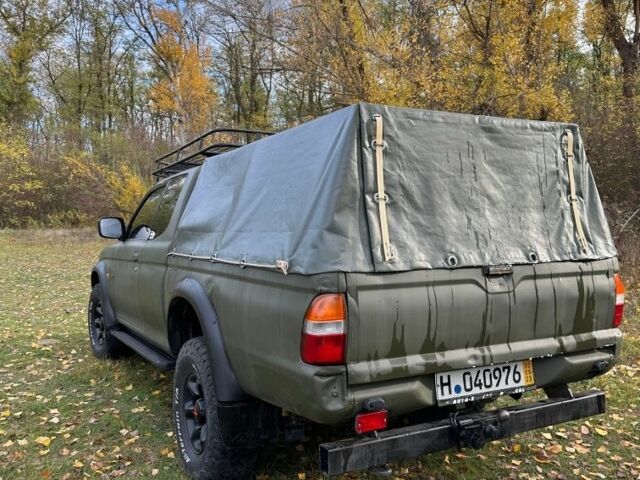 Зеленый Мицубиси Л 200, объемом двигателя 2.5 л и пробегом 280 тыс. км за 5700 $, фото 6 на Automoto.ua