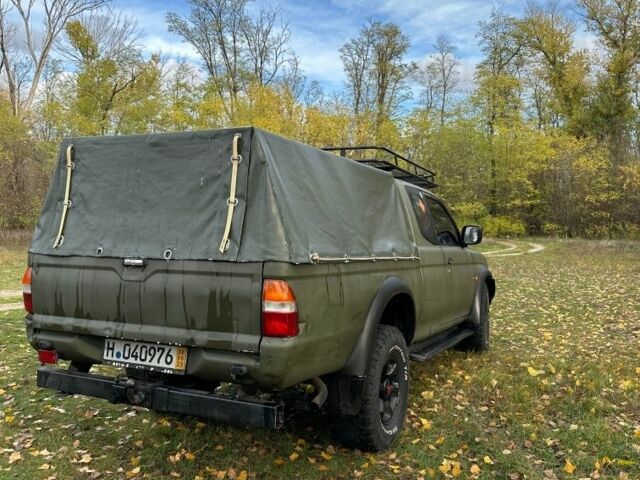 Зеленый Мицубиси Л 200, объемом двигателя 2.5 л и пробегом 280 тыс. км за 5700 $, фото 5 на Automoto.ua