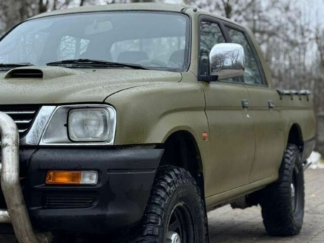 Зеленый Мицубиси Л 200, объемом двигателя 2.5 л и пробегом 197 тыс. км за 2600 $, фото 7 на Automoto.ua