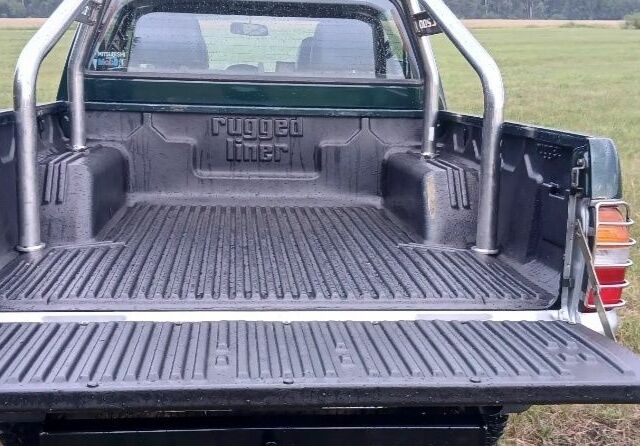 Зеленый Мицубиси Л 200, объемом двигателя 0 л и пробегом 244 тыс. км за 2642 $, фото 6 на Automoto.ua