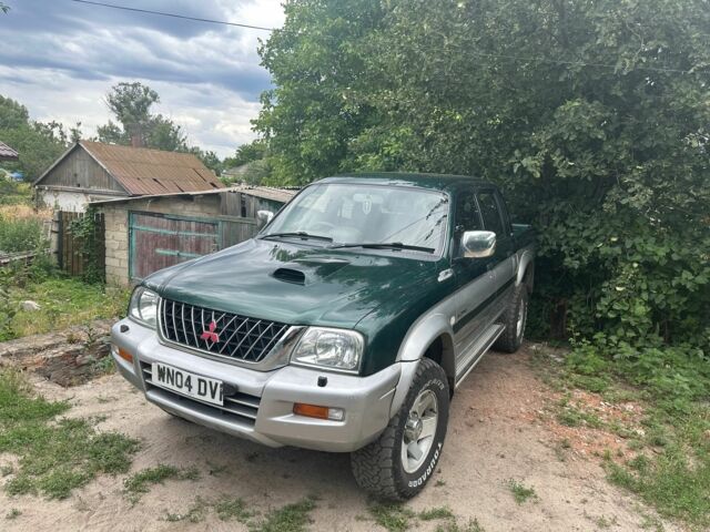 Зеленый Мицубиси Л 200, объемом двигателя 2.5 л и пробегом 124 тыс. км за 4800 $, фото 1 на Automoto.ua