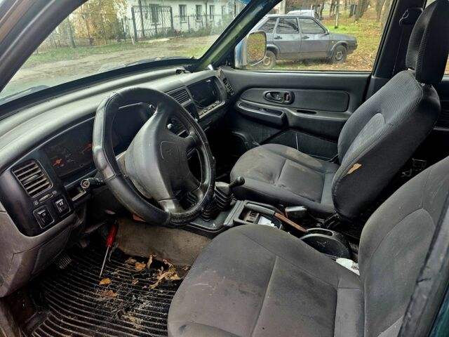 Зелений Міцубісі Л 200, об'ємом двигуна 2.5 л та пробігом 250 тис. км за 2620 $, фото 7 на Automoto.ua