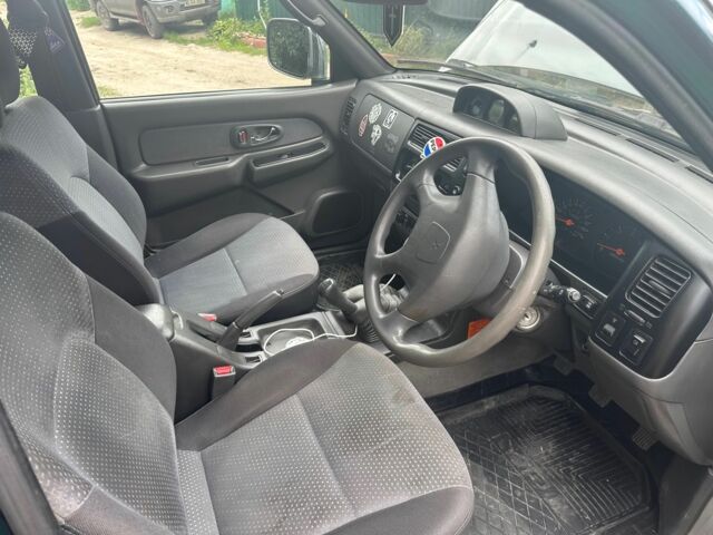 Зеленый Мицубиси Л 200, объемом двигателя 2.5 л и пробегом 124 тыс. км за 4800 $, фото 5 на Automoto.ua