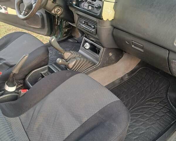 Зеленый Мицубиси Л 200, объемом двигателя 2.5 л и пробегом 264 тыс. км за 5537 $, фото 2 на Automoto.ua