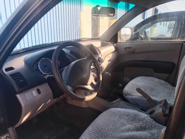 Зеленый Мицубиси Л 200, объемом двигателя 2.5 л и пробегом 170 тыс. км за 7524 $, фото 2 на Automoto.ua