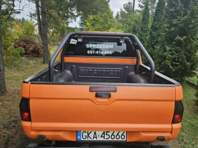 Мицубиси Л 200 2002 в Павлограде на Automoto.ua Оранжевый Мицубиси Л 200, объемом двигателя 2.5 л и пробегом 242 тыс. км за 2902 $, фото 2 на Automoto.ua