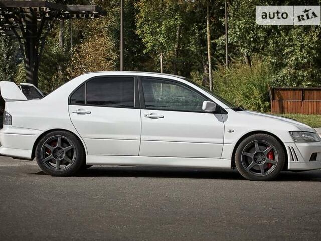 Білий Міцубісі Лансер Еволюшн, об'ємом двигуна 2 л та пробігом 169 тис. км за 25000 $, фото 6 на Automoto.ua