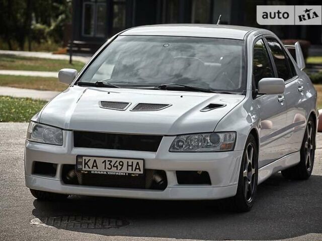 Білий Міцубісі Лансер Еволюшн, об'ємом двигуна 2 л та пробігом 169 тис. км за 25000 $, фото 5 на Automoto.ua
