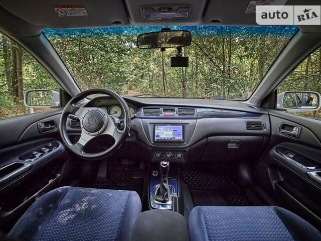 Білий Міцубісі Лансер Еволюшн, об'ємом двигуна 2 л та пробігом 169 тис. км за 25000 $, фото 24 на Automoto.ua