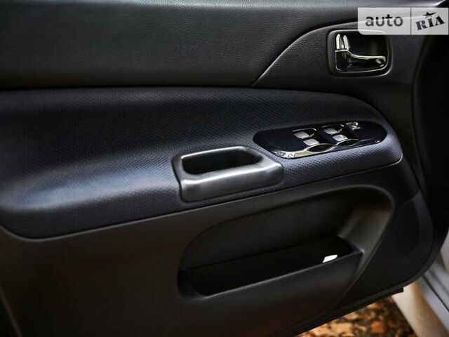 Білий Міцубісі Лансер Еволюшн, об'ємом двигуна 2 л та пробігом 169 тис. км за 25000 $, фото 16 на Automoto.ua