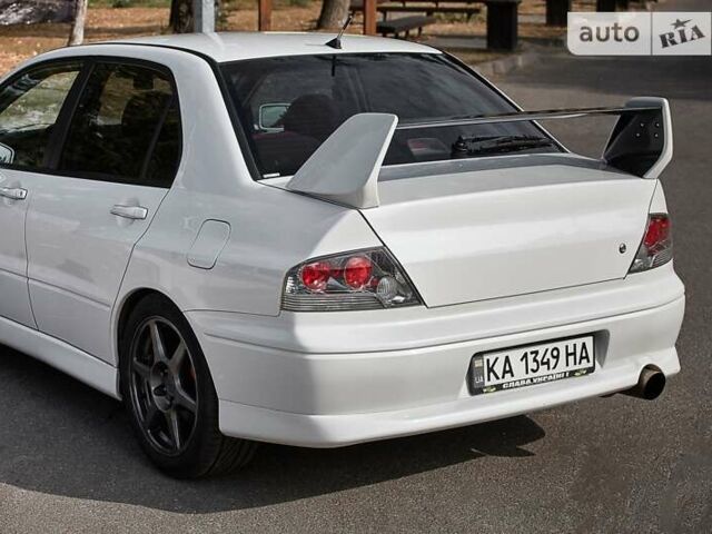 Білий Міцубісі Лансер Еволюшн, об'ємом двигуна 2 л та пробігом 169 тис. км за 25000 $, фото 7 на Automoto.ua