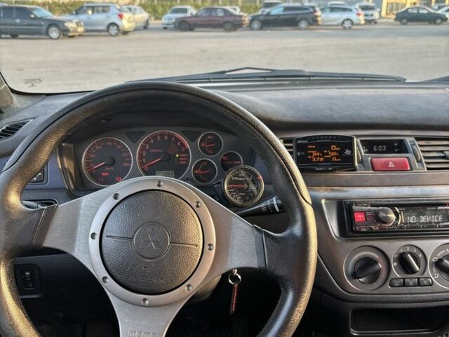 Белый Мицубиси Лансер Эволюшн, объемом двигателя 0 л и пробегом 179 тыс. км за 21499 $, фото 6 на Automoto.ua