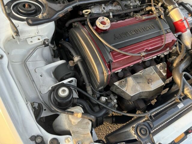 Белый Мицубиси Лансер Эволюшн, объемом двигателя 0 л и пробегом 179 тыс. км за 21499 $, фото 7 на Automoto.ua