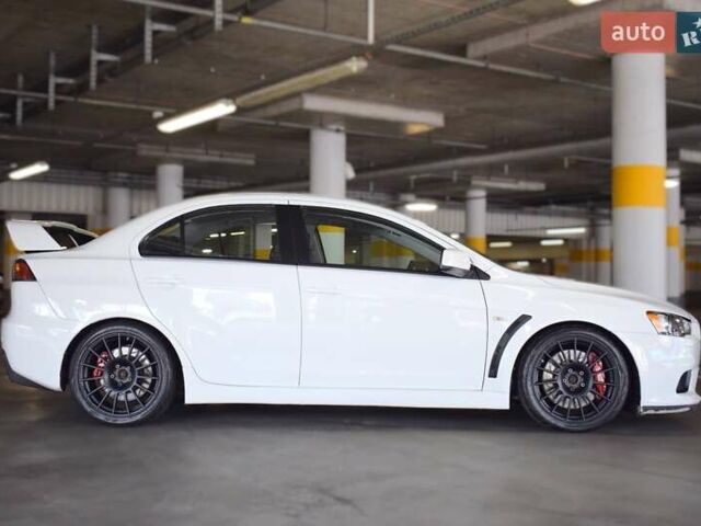 Білий Міцубісі Лансер Еволюшн, об'ємом двигуна 2 л та пробігом 96 тис. км за 24900 $, фото 6 на Automoto.ua