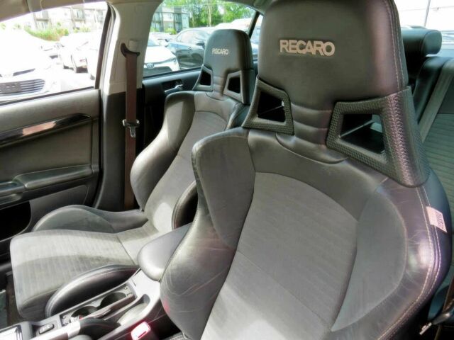 Белый Мицубиси Лансер Эволюшн, объемом двигателя 2 л и пробегом 86 тыс. км за 9900 $, фото 8 на Automoto.ua