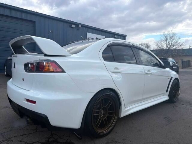 Білий Міцубісі Лансер Еволюшн, об'ємом двигуна 2 л та пробігом 82 тис. км за 6400 $, фото 6 на Automoto.ua